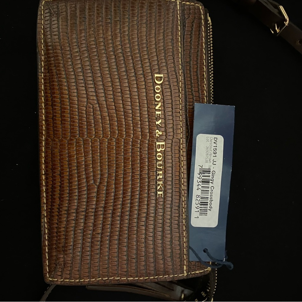 Dooney and Burke Crossbody brown lizard leather material. like new.